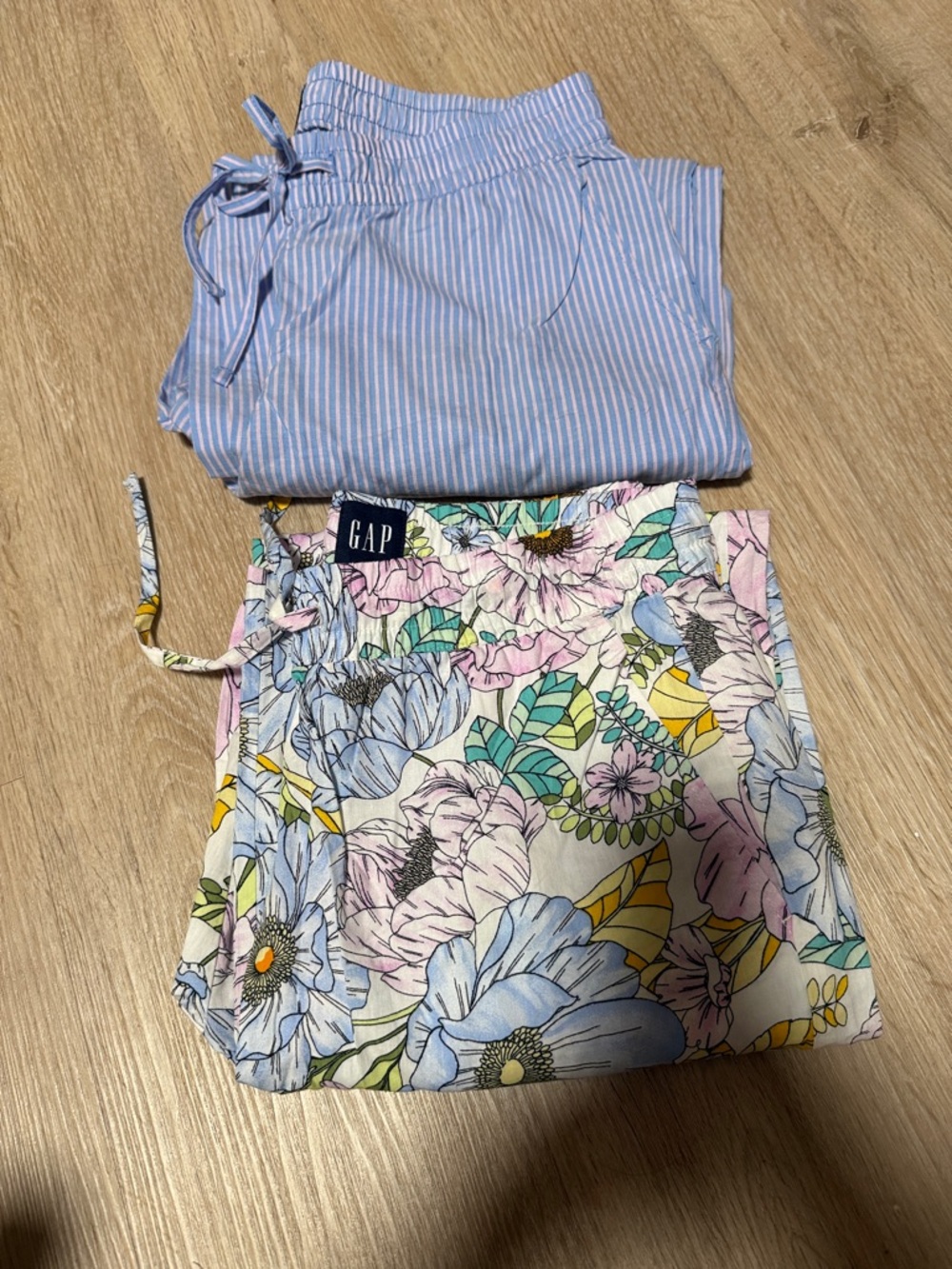GAP 1 Blue Striped draw string pajama pants and 1 flowered pajama pants .